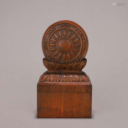 A boxwood carved flower seal