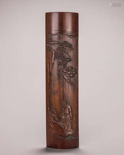 A carved bamboo arm rest