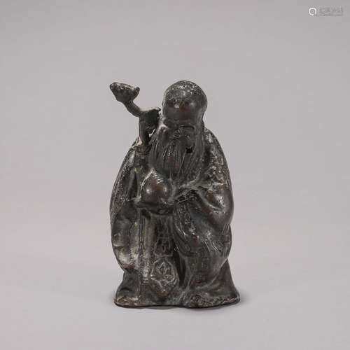 A copper figurine ornament