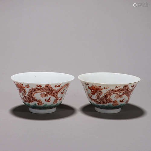 A pair of iron red cloud and dragon porcelain bowls