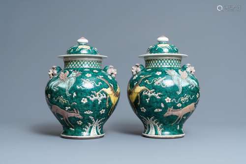 A PAIR OF CHINESE FAMILLE VERTE 'MYTHICAL ANIMALS'...