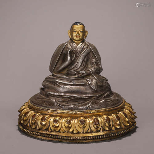 A silver buddha statue