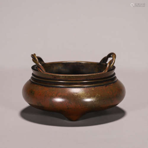 A three-legged double-eared copper censer