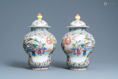 A PAIR OF CHINESE FAMILLE ROSE YELLOW-GROUND VASES AND COVER...