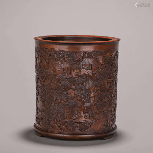 A carved bamboo brush pot