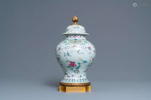 A CHINESE FAMILLE ROSE VASE AND COVER WITH GILT BRONZE MOUNT...
