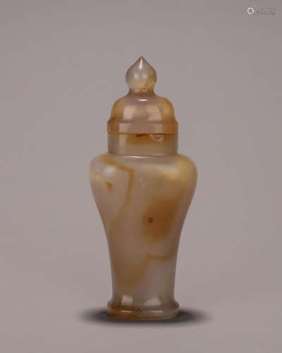 An agate hat-covered vase