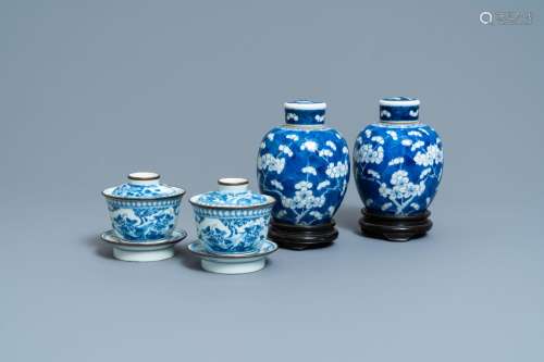 A PAIR OF CHINESE BLUE AND WHITE COVERED BOWLS ON STANDS AND...