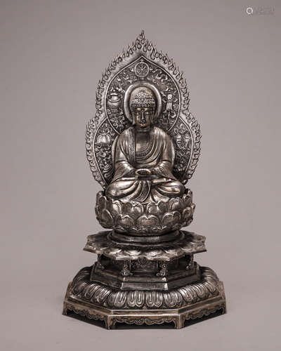 A silver Sakyamuni buddha statue