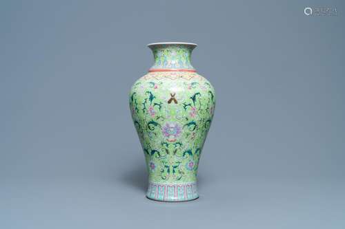 A CHINESE FAMILLE ROSE LIME-GREEN-GROUND VASE, QIANLONG MARK...