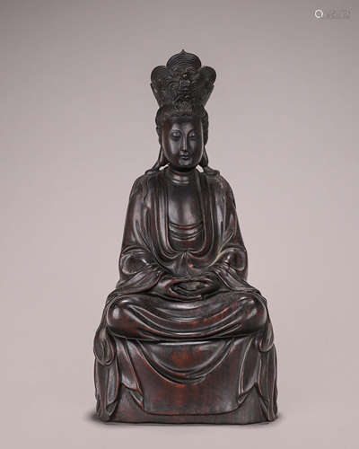 A red sandalwood Guanyin statuette