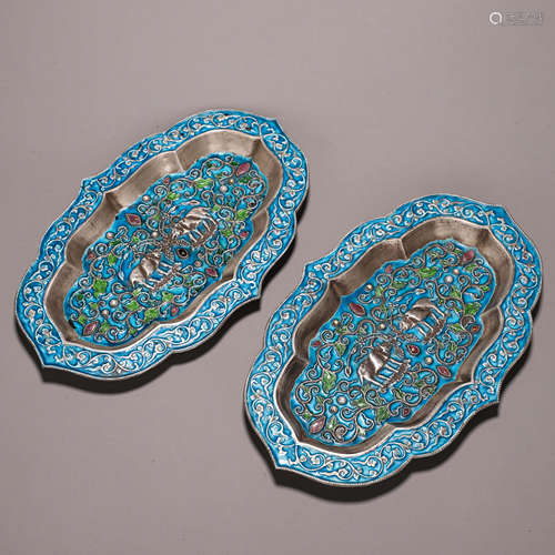 A pair of beast patterned silver enamel plates