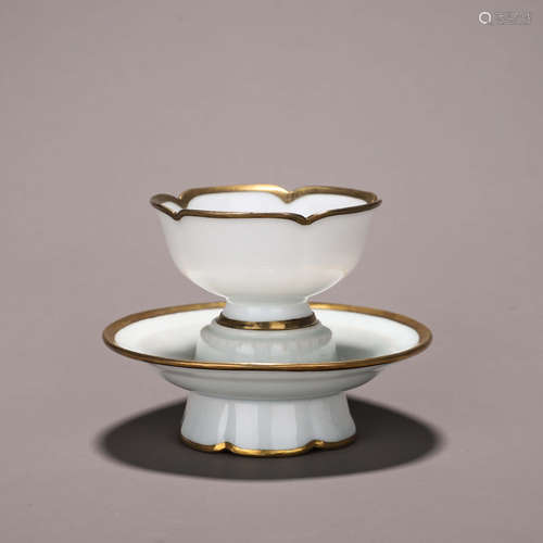 A white glazed porcelain gold-inlaid cup and saucer