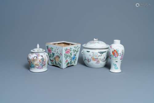 A CHINESE FAMILLE ROSE JARDINIERE, TWO VASES AND A COVERED B...