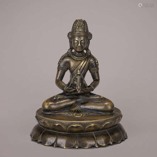 A copper Amitabha buddha statue