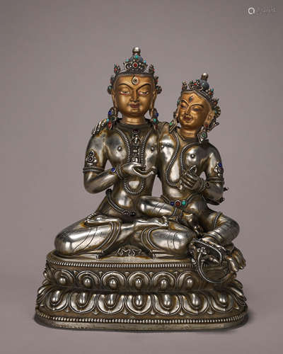 A silver buddha statue