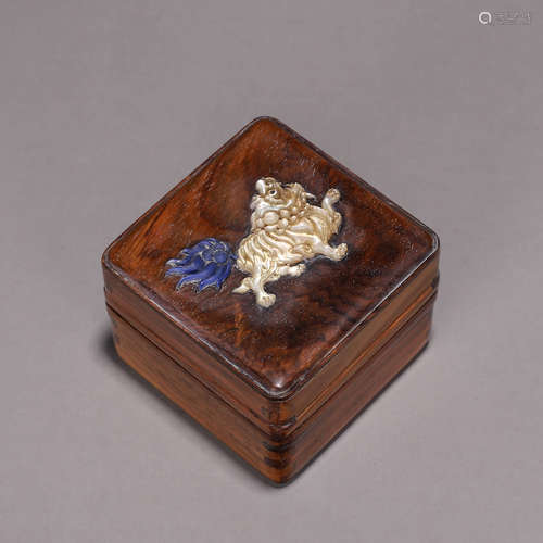 A fragrant rosewood gem-inlaid lion box