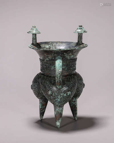 A taotie patterned three-legged bronze jue cup