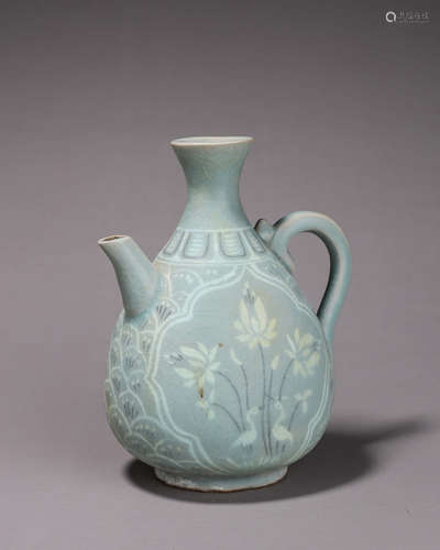 A bird and flower celadon porcelain wine pot