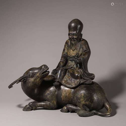 A bronze figurine and ox ornament