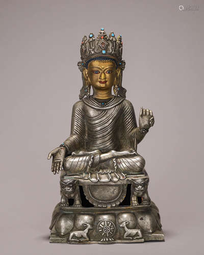 A silver Sakyamuni buddha statue