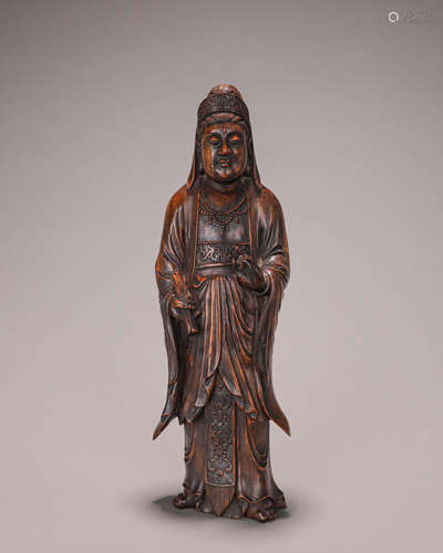 A fragrant rosewood Guanyin statuette