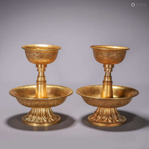 A pair of flower gilding copper candlesticks