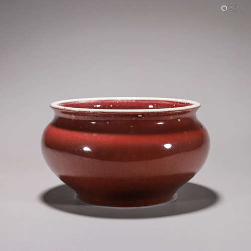 A deep red glazed porcelain vat