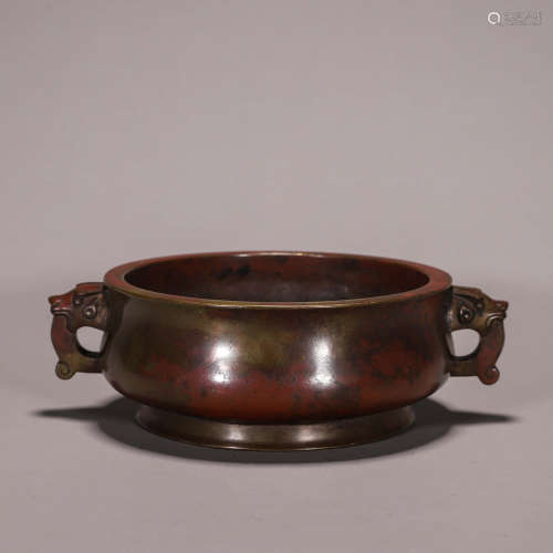 A copper censer with dragon shaped ears
