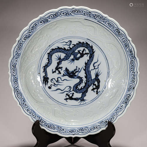 A blue and white dragon carved porcelain plate