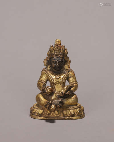 A gilding copper yellow Jambhala statue