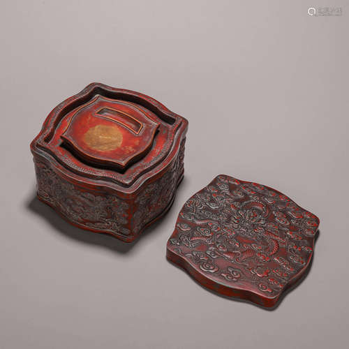 A cloud and dragon patterned cinnabar inkstone