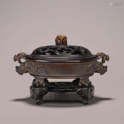 A four-legged copper censer with dragon shaped ears