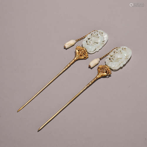 A pair of Hetian jade gold-inlaid phoenix bird hair pins