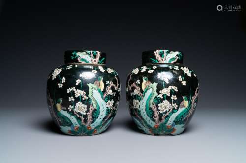 A PAIR OF CHINESE FAMILLE NOIRE JARS AND COVERS, 19TH C.