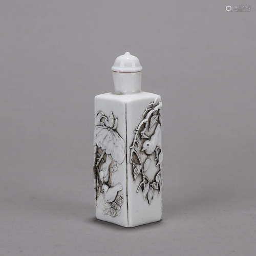 A carved bird porcelain snuff bottle