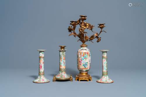 THREE CHINESE CANTON FAMILLE ROSE CANDLESTICKS AND A VASE WI...