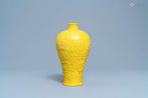 A CHINESE RELIEF-MOLDED MONOCHROME YELLOW 'MEIPING'...