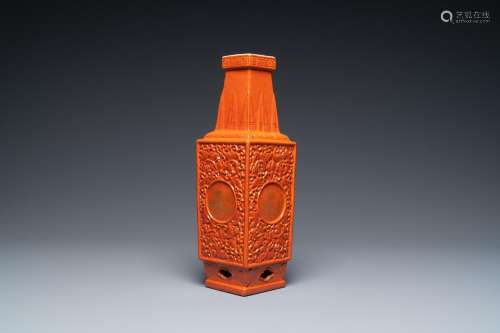 A CHINESE MONOCHROME CORAL-RED RELIEF-MOLDED VASE, 19/20TH C...