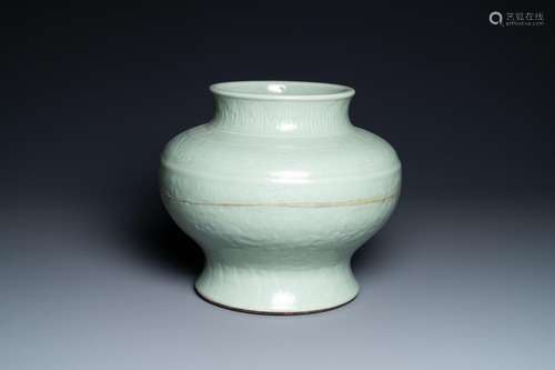 A CHINESE MONOCHROME CELADON VASE WITH UNDERGLAZE FLORAL DES...