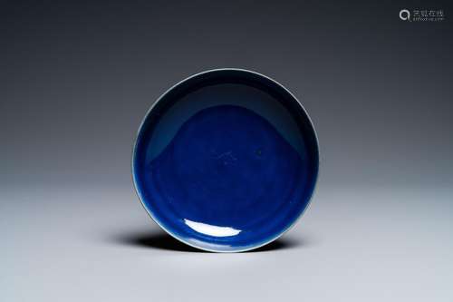 A CHINESE MONOCHROME BLUE DISH, QIANLONG MARK AND OF THE PER...