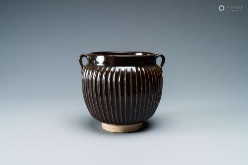 A CHINESE BLACK-GLAZED RIBBED TWO-HANDLED JAR, NORTHERN SONG...