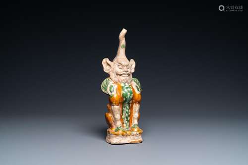 A CHINESE SANCAI-GLAZED POTTERY 'EARTH SPIRIT' FIG...