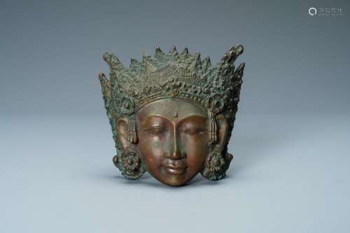 A BRONZE MASK OF A FEMALE DEITY, TIBET OR SOUTH EAST ASIA, 1...