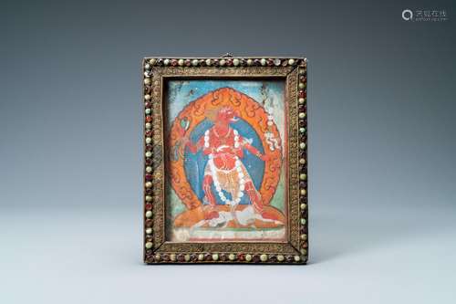 A TIBETAN THANGKA IN INLAID GILT BRASS FRAME, 19TH C.