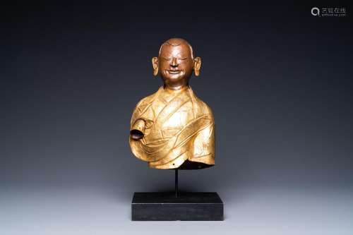 A TIBETAN PARTLY GILDED BRASS BUST OF A BUDDHIST MONK, 18TH ...