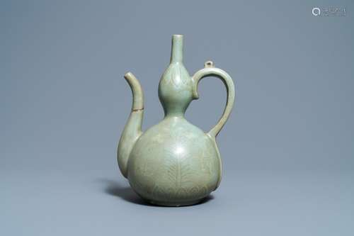 A KOREAN INLAID-CELADON STONEWARE EWER, PROBABLY GORYEO, 13/...