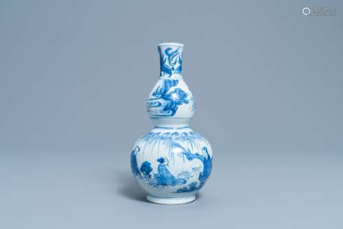 A CHINESE BLUE AND WHITE DOUBLE GOURD VASE WITH FIGURES IN A...