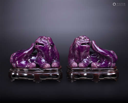 18th century, A pair of eggplant purple glazed lions