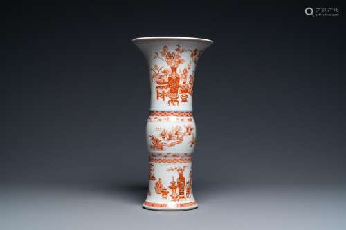A CHINESE IRON-RED AND GILT 'GU' VASE WITH ANTIQUI...